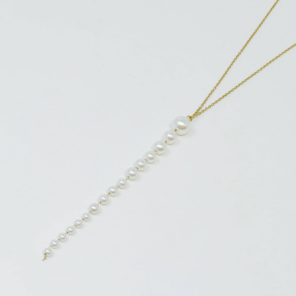 Gradient long pearl drop necklace on a gold chain 