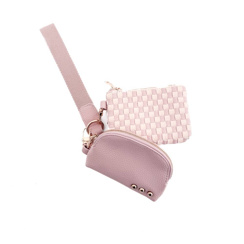 A pink and white wristlet pouch with a curved design and gold zipper.