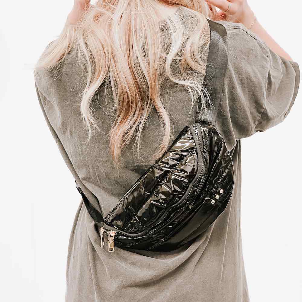 Lady with a patent leather crossbody/bum bag